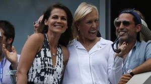 Tennis great Martina Navratilova and her partner Lemigova celebrate after Nishikori of Japan defeated Djokovic of Serbia in their semi-final match at the 2014 U.S. Open tennis tournament in New York