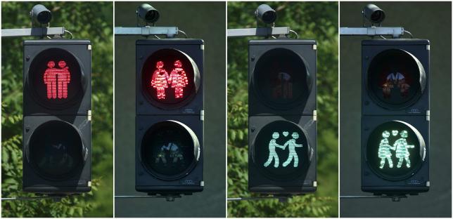 A combination of photos shows gay-themed traffic lights in Vienna May 11, 2015. REUTERS/Heinz-Peter Bader