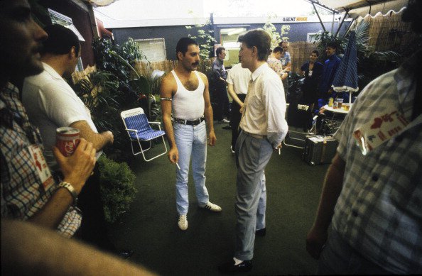 Queen singer Freddie Mercury and David Bowie talking backstage at the Live Aid concert, Wembley Stadium, London, 13th July 1985. (Photo by Denis O'Regan/Getty Images)