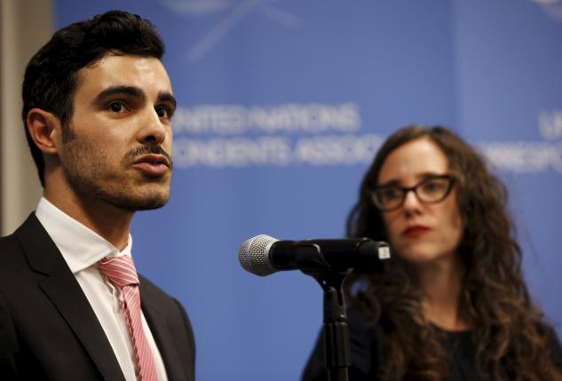 Gay Syrian refugee Subhi Nahas (L) speaks as Jessica Stern, Executive Director of the International Gay & Lesbian Human Rights Commission (R) looks on, at a news conference at the United Nations headquarters in New York, August 24, 2015.  REUTERS/Mike Segar