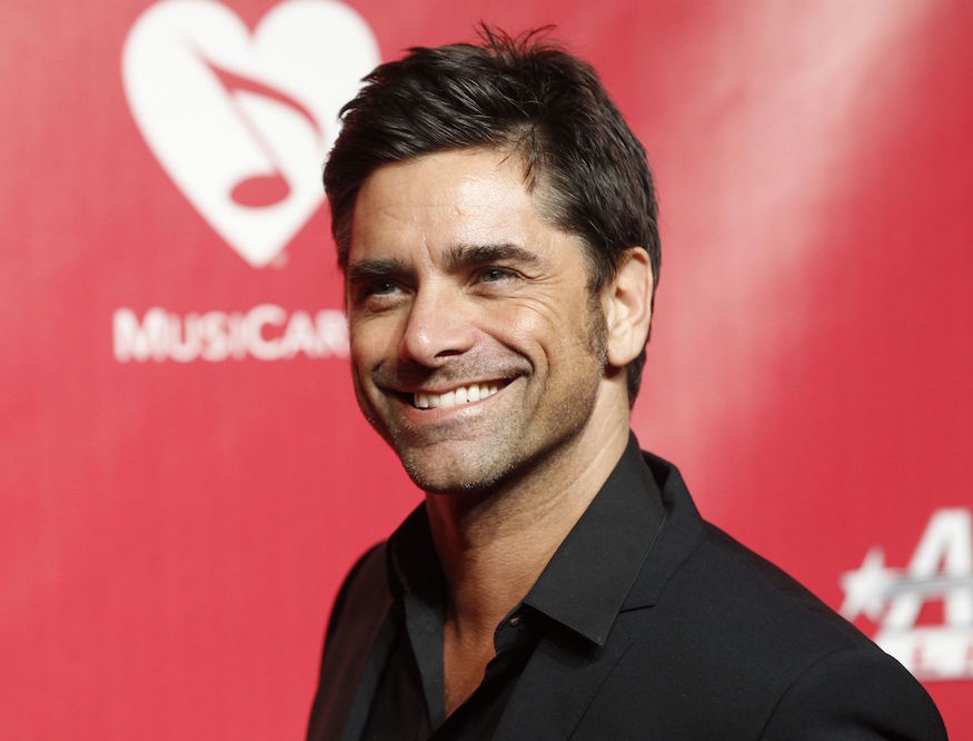 john stamos red background reuters