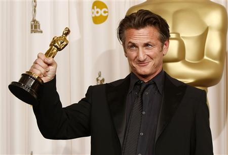 Sean Penn holds up his Oscar for best actor for his role in "Milk" backstage at the 81st Academy Awards in Hollywood, California