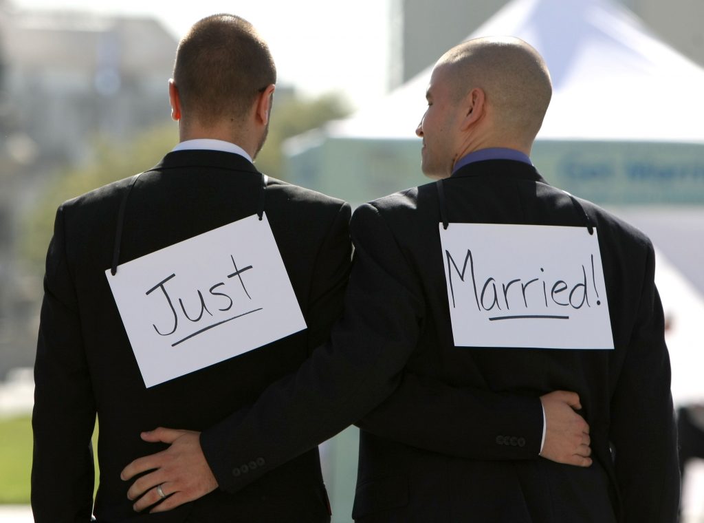 SAN FRANCISCO - JUNE 17:  Same-sex couple Ariel Owens (R) and his spouse Joseph Barham walk arm in arm after they were married at San Francisco City Hall June 17, 2008 in San Francisco, California. Same-sex couples throughout California are rushing to get married as counties begin issuing marriage license after a State Supreme Court ruling to allow same-sex marriage.  (Photo by Justin Sullivan/Getty Images)