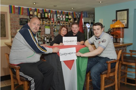The Central Bar's owner (third from the left) and his staff holding a fundraiser for Gaza at the bar.