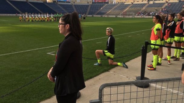 Rapinoe kneeling during the National Anthem at the start of a recent match.