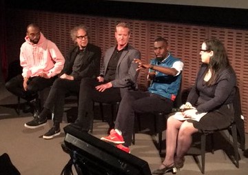 Deray (2nd from right) and Dan (center) speaking at a panel in May 2016.
