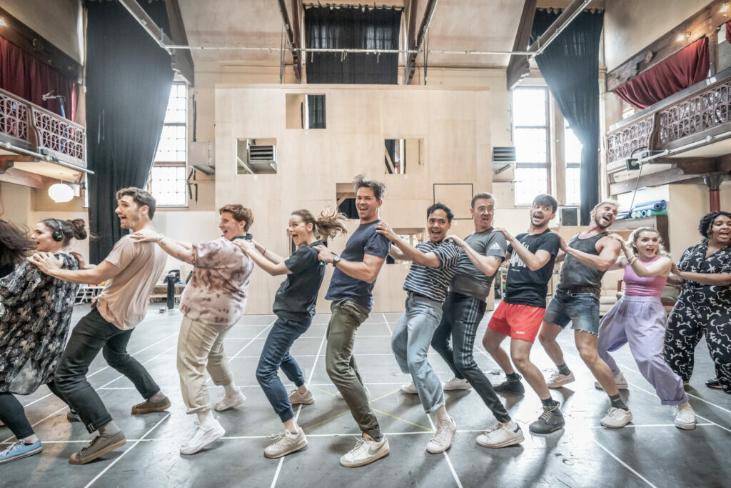 Katie Brayben, Andrew Rannells and the cast of Tammy Faye in rehearsal