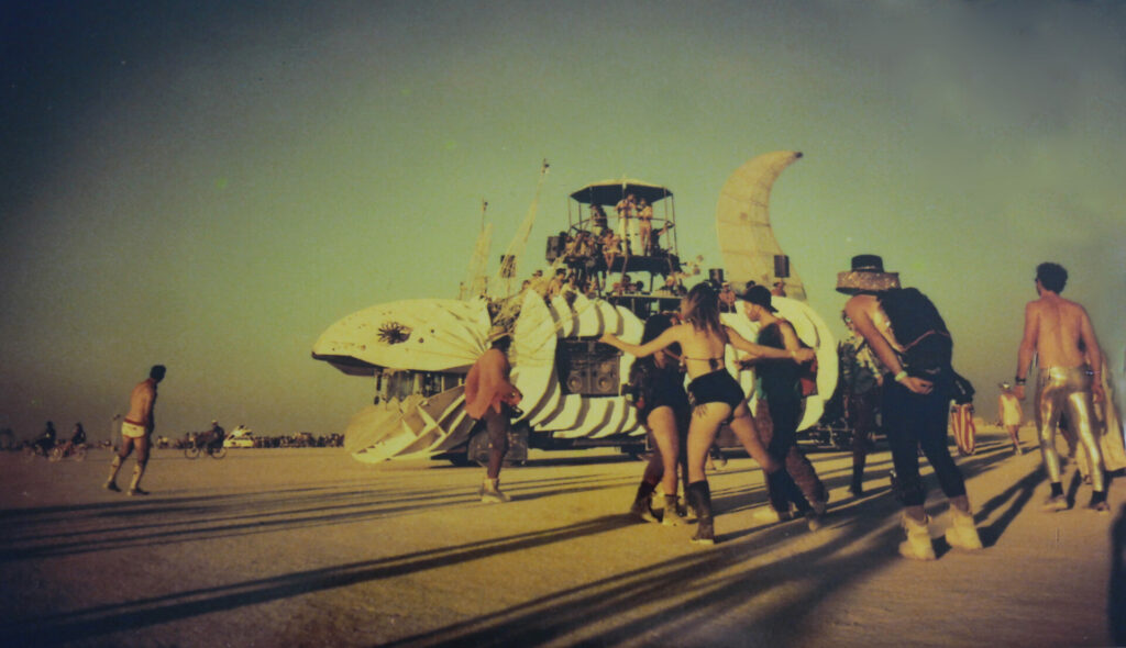 A sound car provides the music for a spontaneous sunset dance party