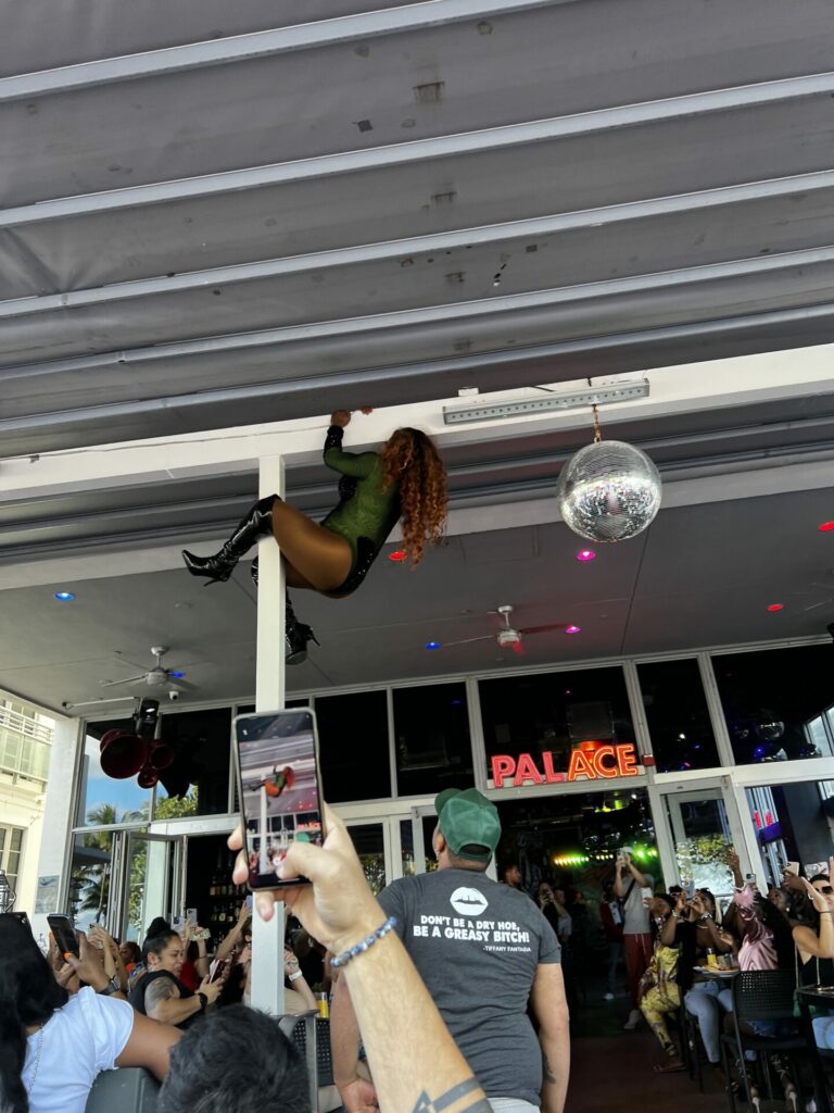 No grease required for climbing drag queen Elishaly D'witshes at Miami Beach's The Palace