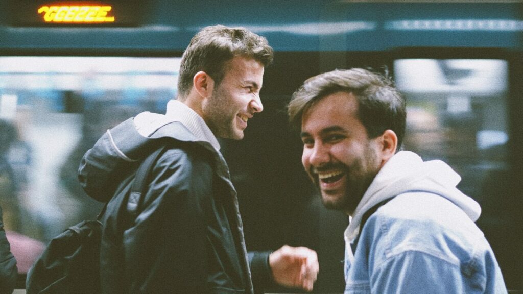 Two guys at a train station