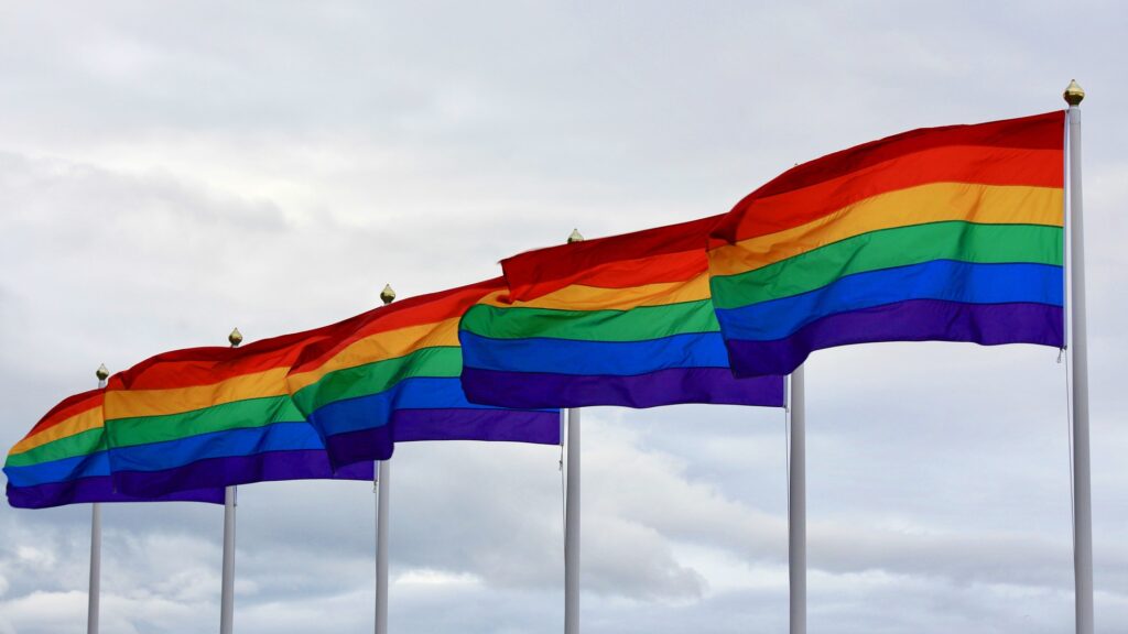 five rainbow pride flags