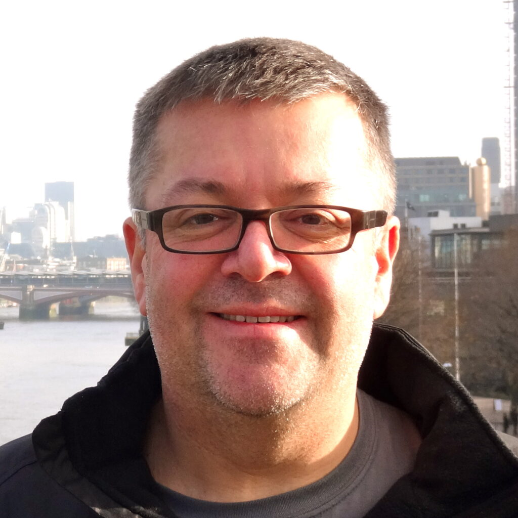 Headshot of a man wearing glasses