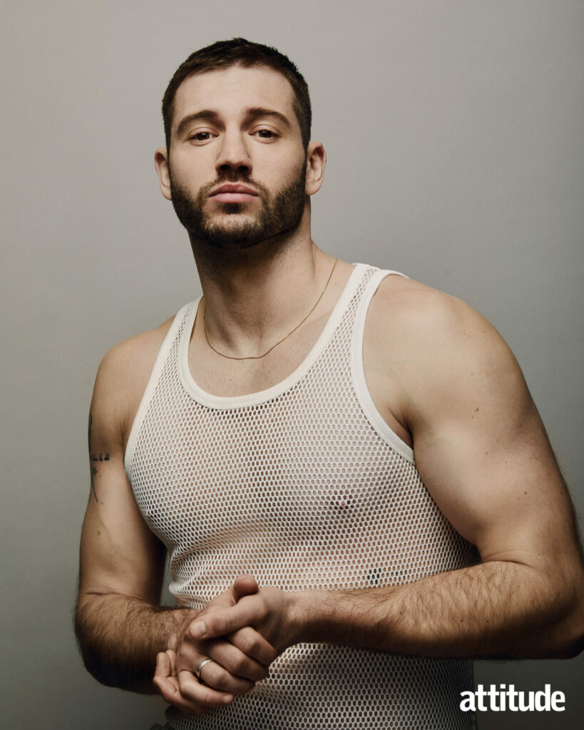 Alexander Lincoln in a mesh white vest