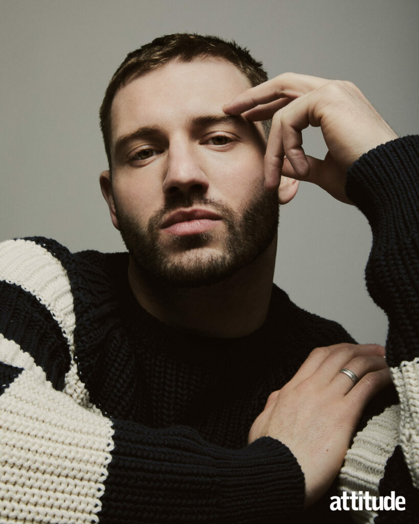 Alexander Lincoln in a black and white striped jumper.