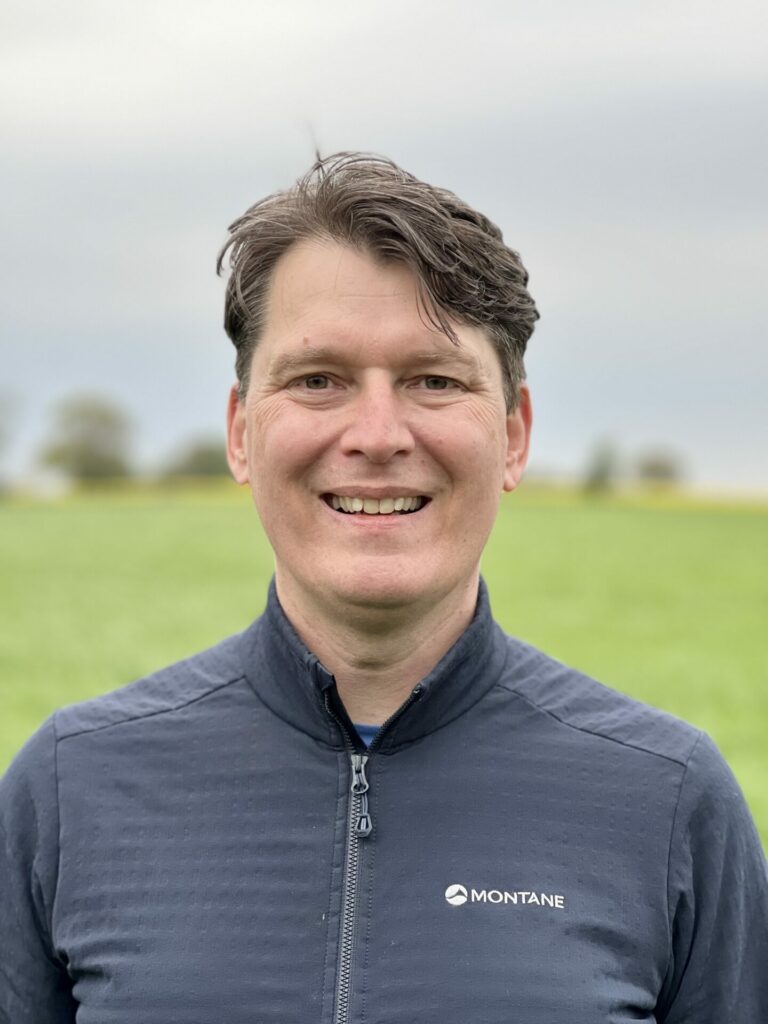 portrait image of Bruno Vinel, he's a white man with brown hair wearing a navy jacket.