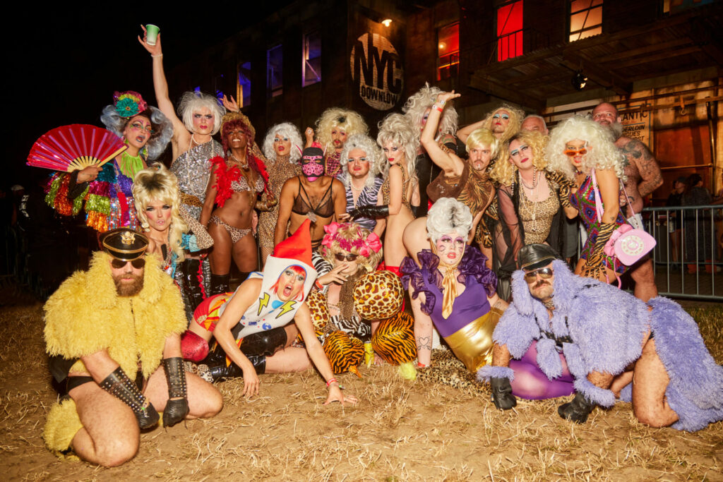 a group of drag queens and glamorous, dressed up people outside NYC Downlow