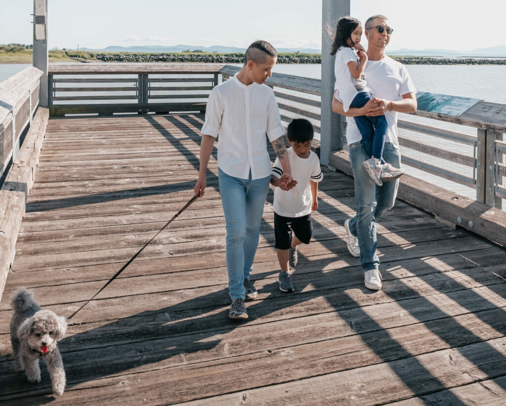 queer couple on holiday with their children