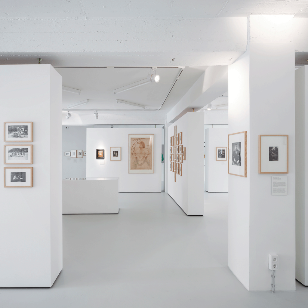 White interior of a museum with frames on the walls