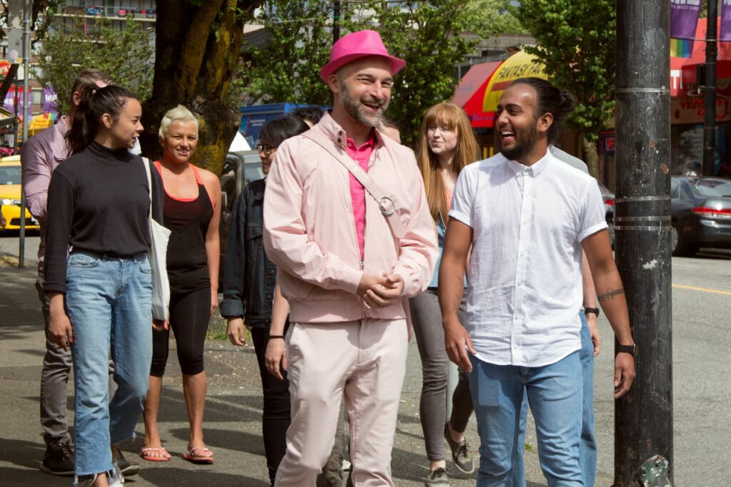 A group of people walk along a Vancouver street