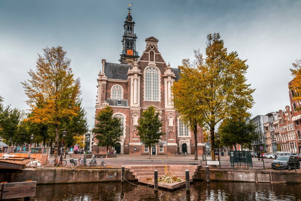 A church stands in front of a canal in Amsterdam