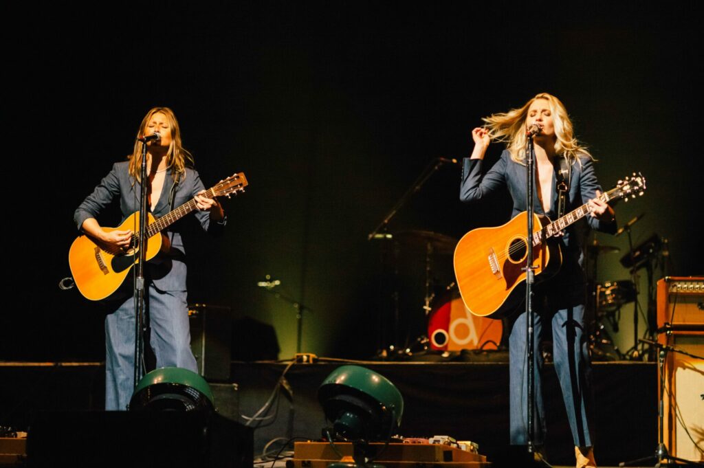 Aly and AJ performing on stage