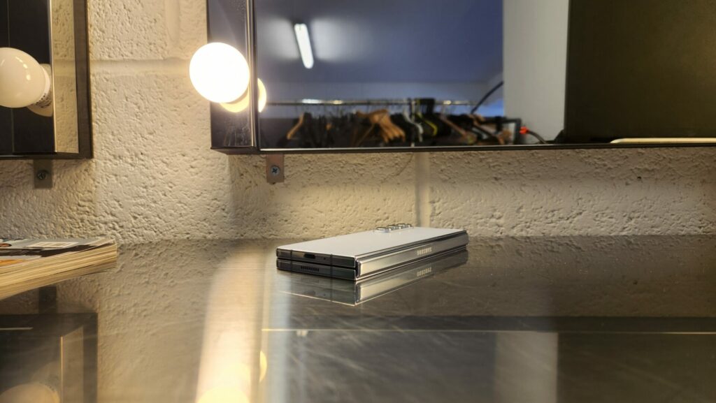 Samsung Z Fold 5 sitting closed on a metal desk