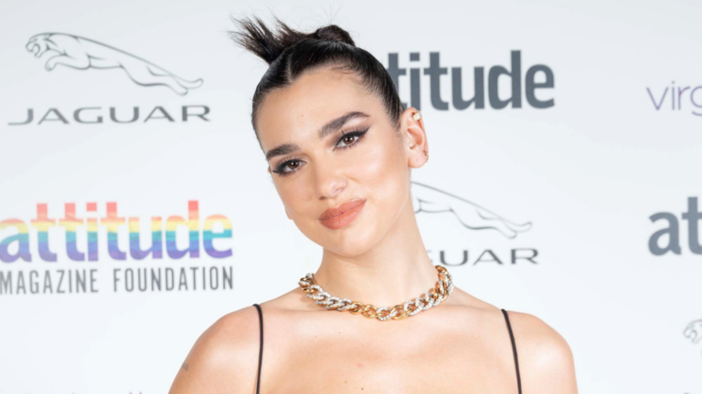 Close up of Dua Lipa on a red carpet at the Attitude awards