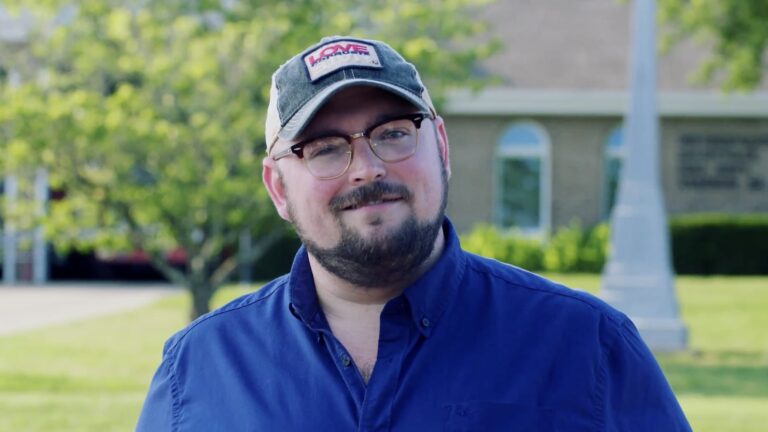 Eric Patton in a blue shirt and cap