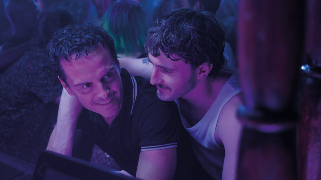 All of Us Strangers film still - Andrew Scott and Paul Mescal in purple light