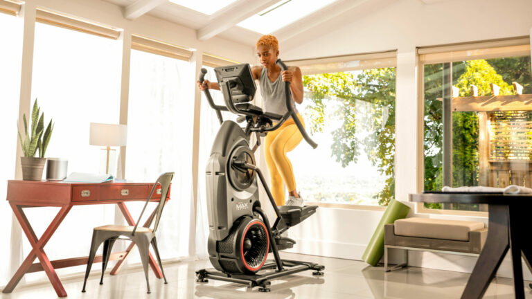 A person exercising on a trainer machine