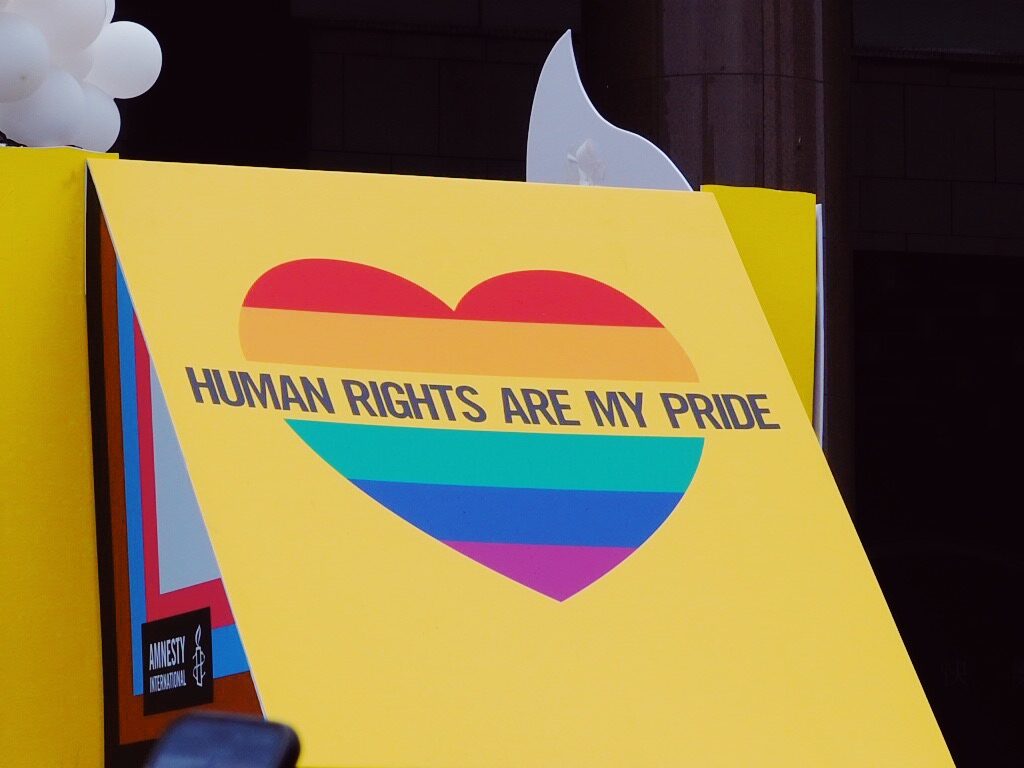 Image of a flag saying "Human rights are my Pride"