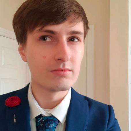 A person wearing a blue suit