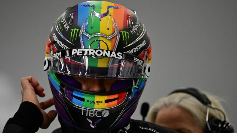 Lewis Hamilton wears a rainbow helmet