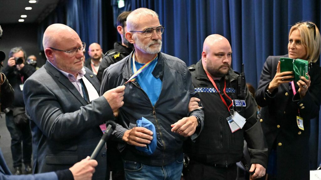 Andrew Boff being escorted out Tory party conference