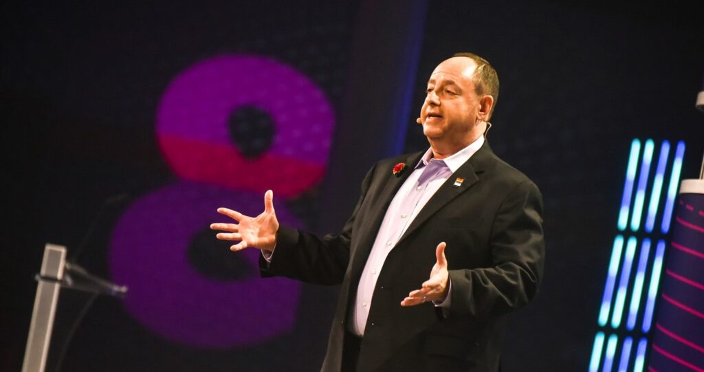 A man delivers a speech onstage