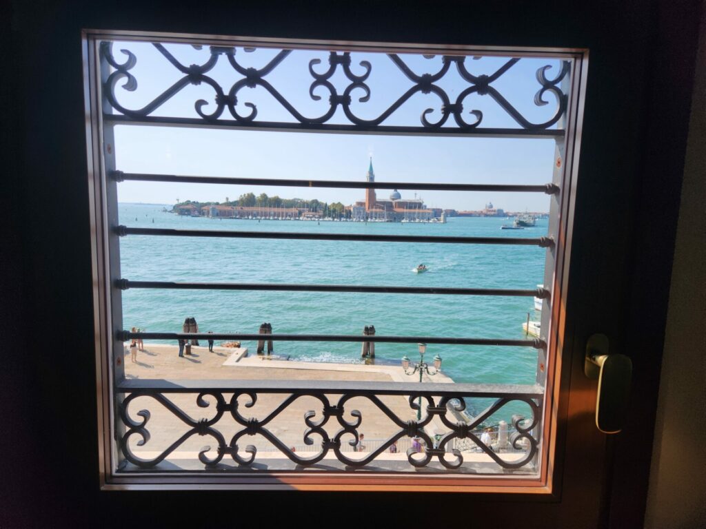 Close up of a window overlooking the Venice Lagoon