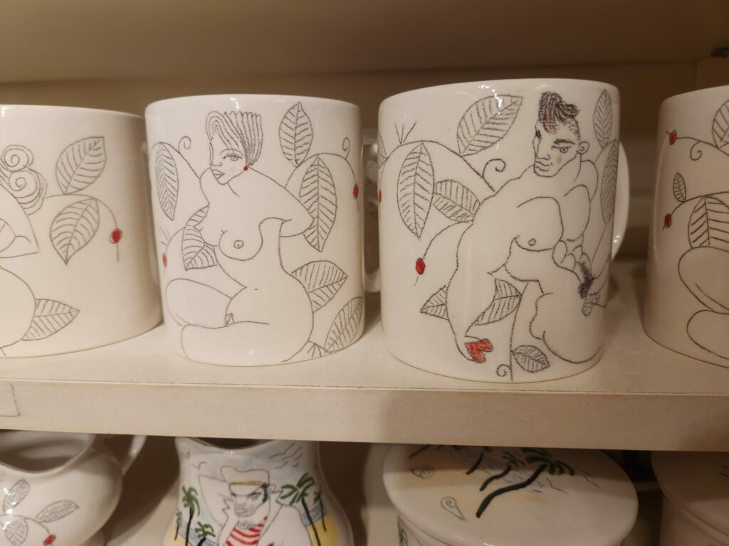 Close up of mugs with nude artworks on them