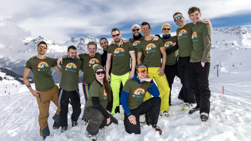 Group of people stand on a snowy mountain