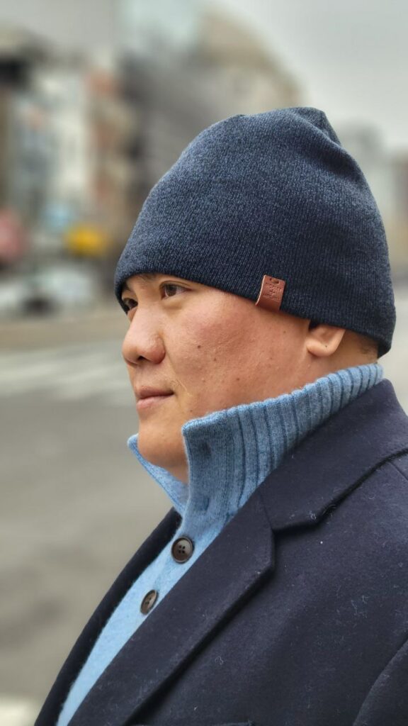 Side profile shot of a man wearing winter clothing