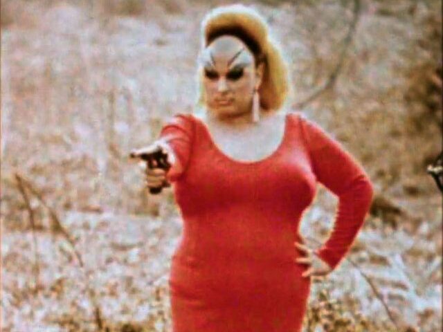 Screenshot from the original 1972 theatrical trailer for the film Pink Flamingos, starring Divine.