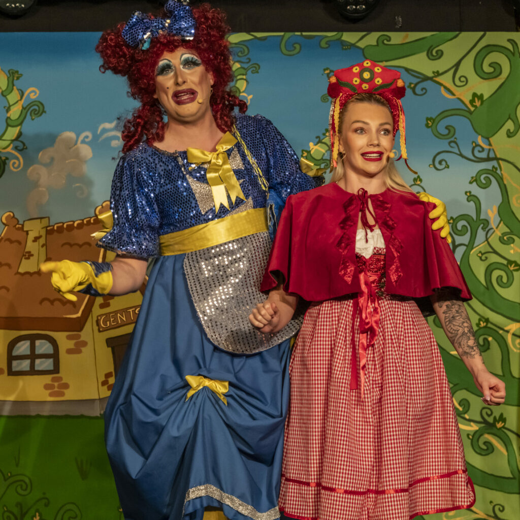 Two pantomime characters on stage