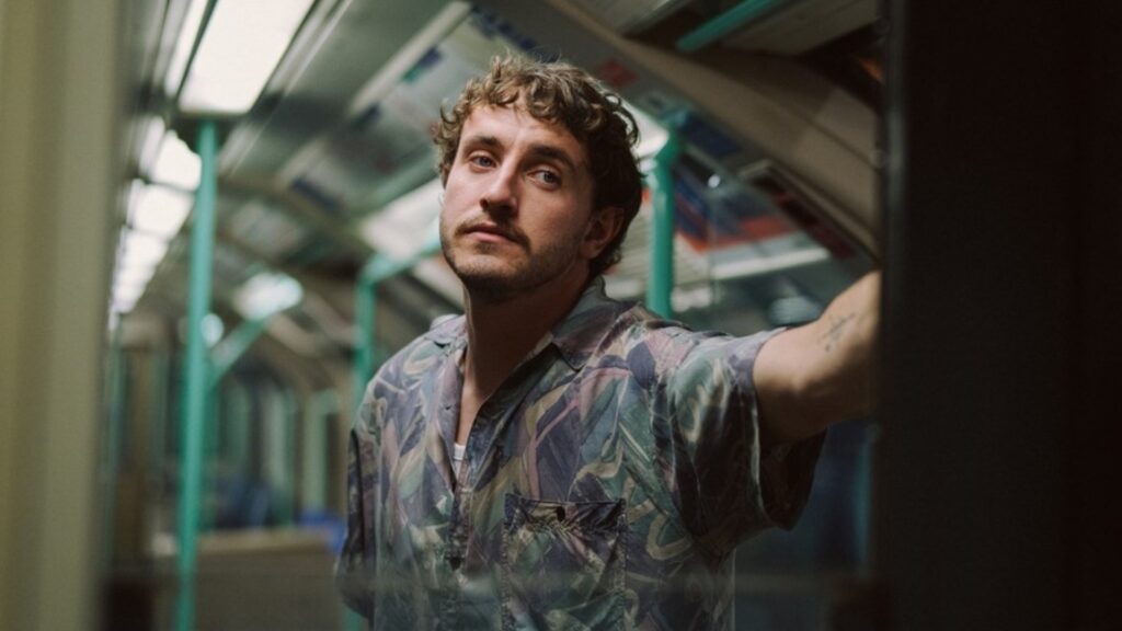 Paul Mescal in All of Us Strangers standing in a Tube carriage