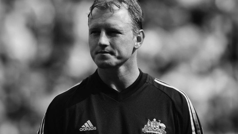Black and white profile shot of Stephen Laybutt in a football top