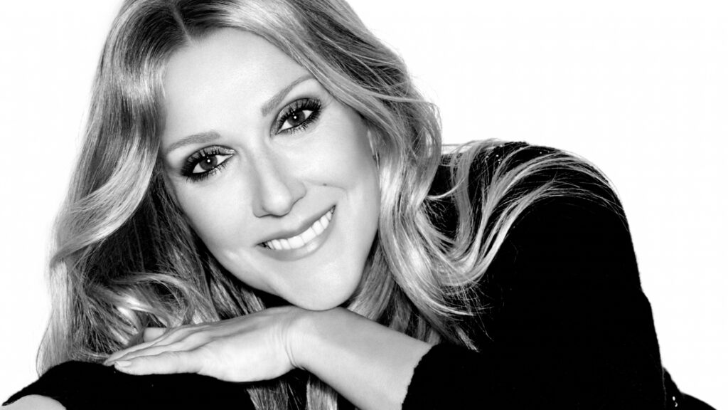 A black and white headshot of Celine Dion