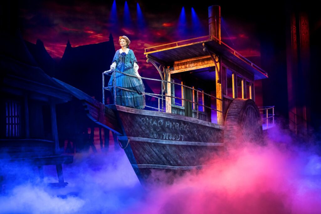 Helen George emerges onstage on a ship in the King and I