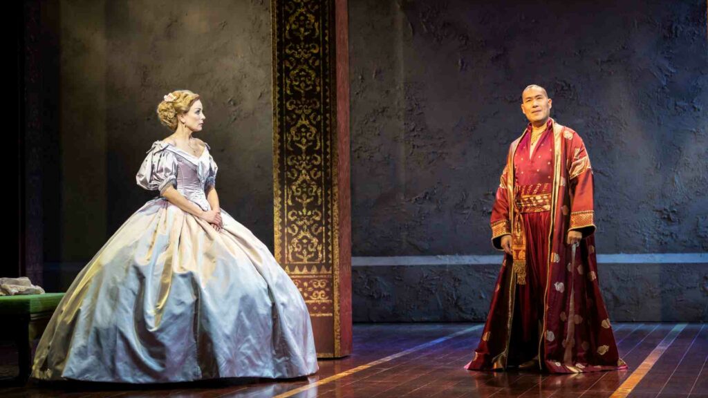 Helen George (Anna Leonowens) and Darren Lee (King Of Siam) appear onstage in The King and I