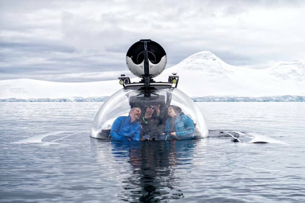 John in a subersible that's about to dive to the Antarctic seabed during an Antarctic sailing trip overseen by EYOS Expeditions 