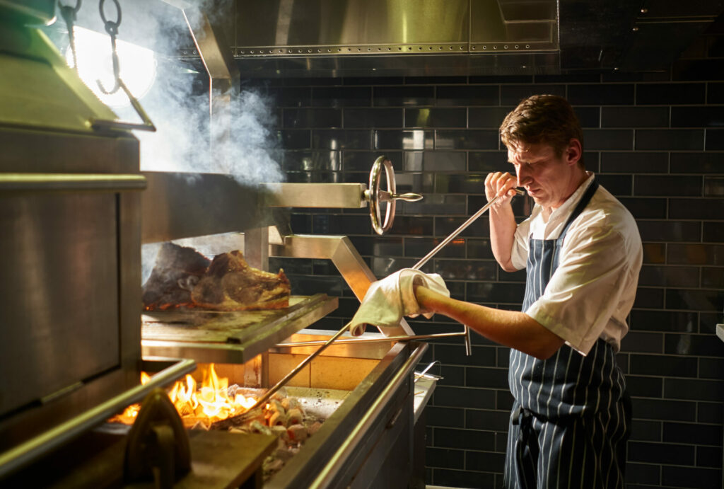 Bristol Avon Gorge by Hotel du Vin's chef working the coal-fired grill in Gorman & Vincent restaurant