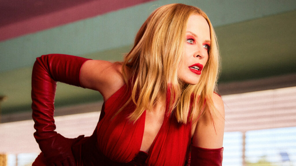 Kylie Minogue wearing a red dress