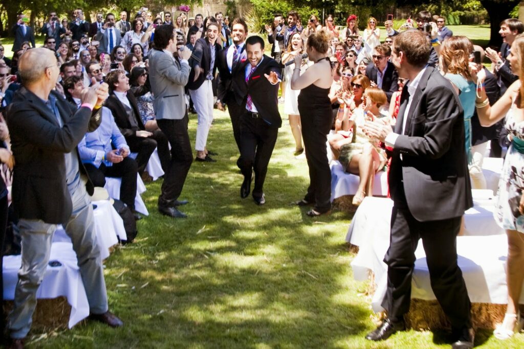 A busy wedding gathering outdoors